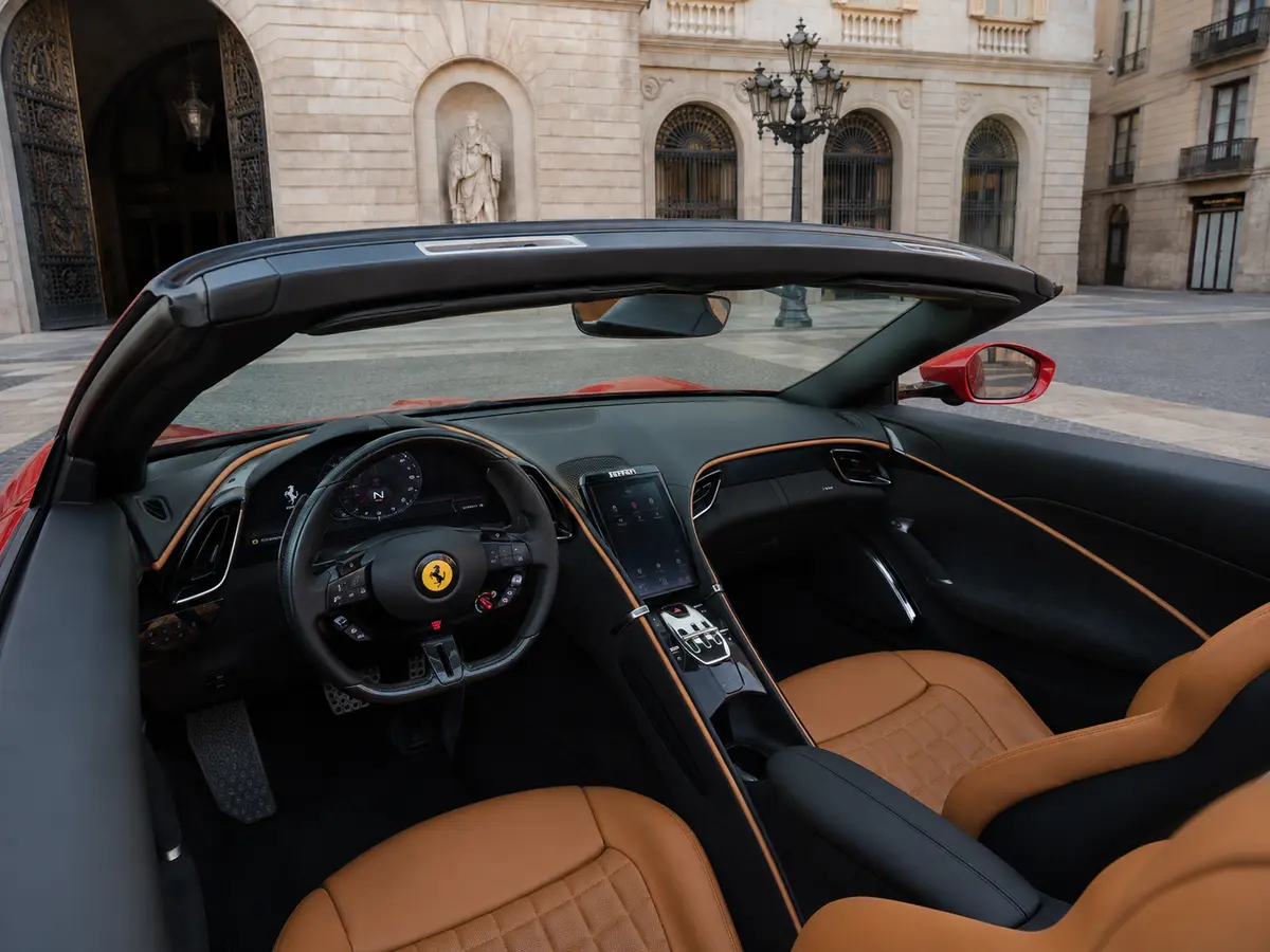 Ferrari Roma Spider 2024, interior — Monaco Luxury Car Rental, Monaco. Ferrari Roma Spider in Monaco A Ferrari Roma Spider rental in Monaco pairs open-top…